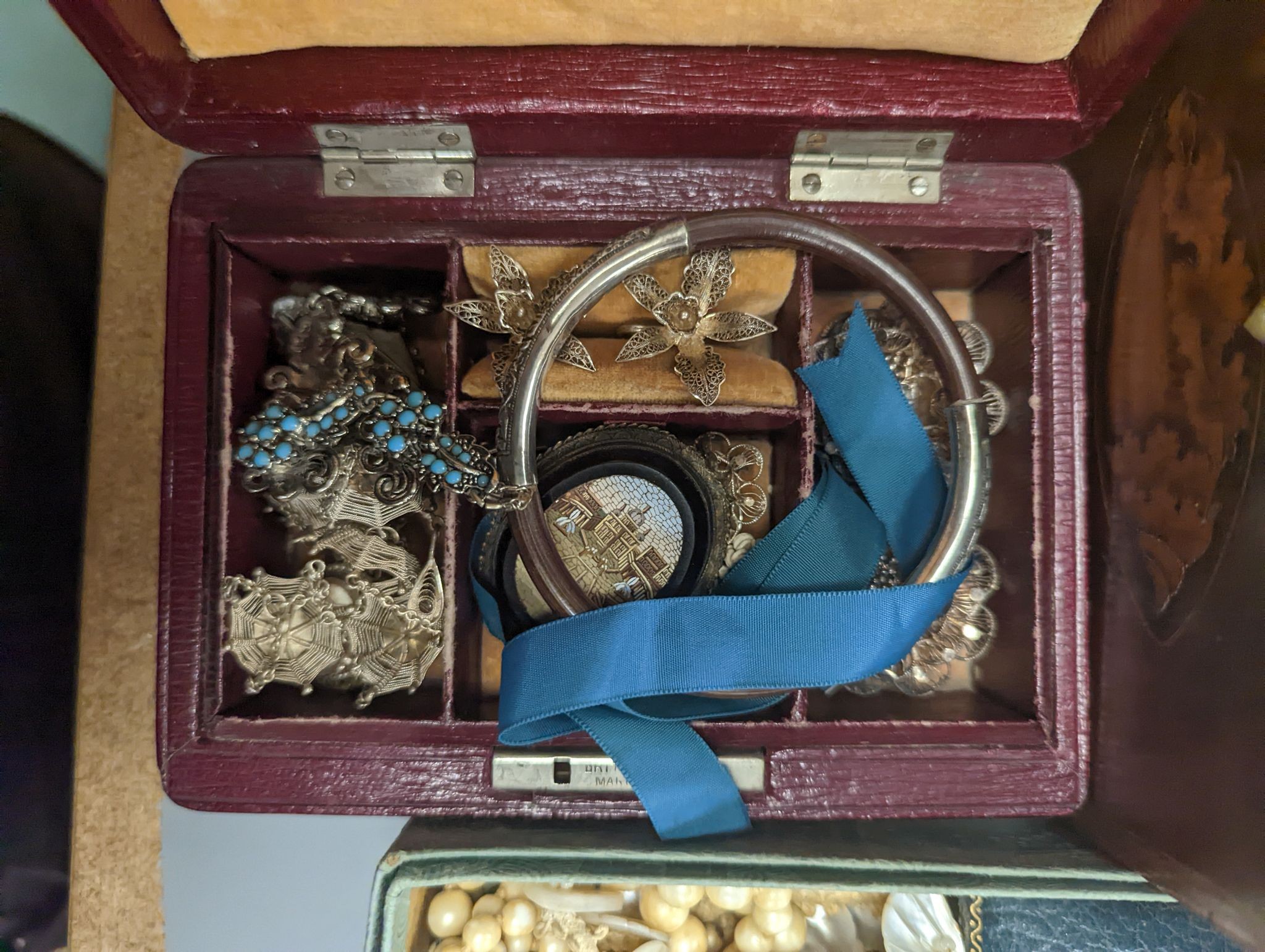 A quantity of assorted Victorian and later jewellery including costume and filigree and a 19th century tea caddy with conch shell inlay.